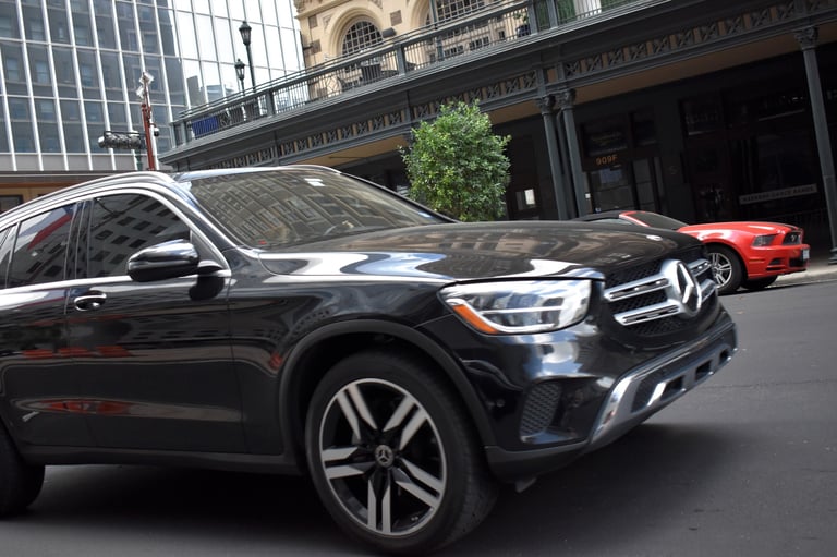 Black Mercedes-Benz GLC 300 SUV in downtown Houston
